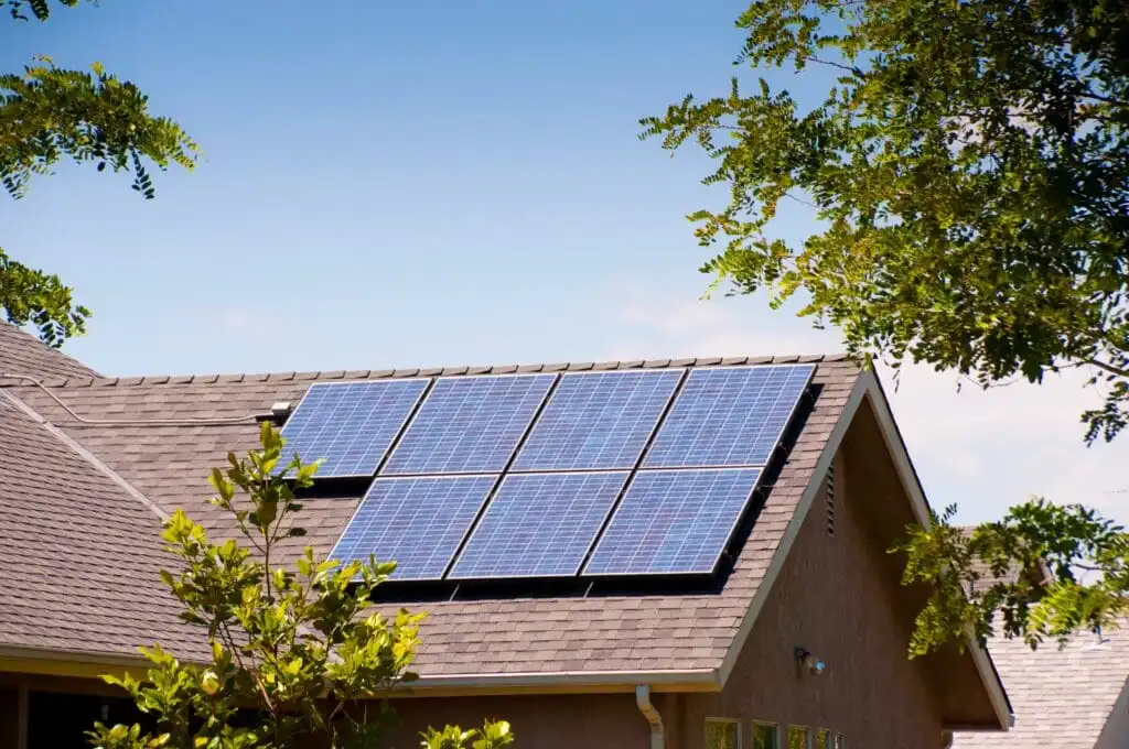 Solar panels on a rooftop being cleaned with pure water